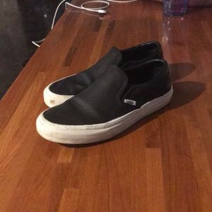 Vans black perforated leather slip ons